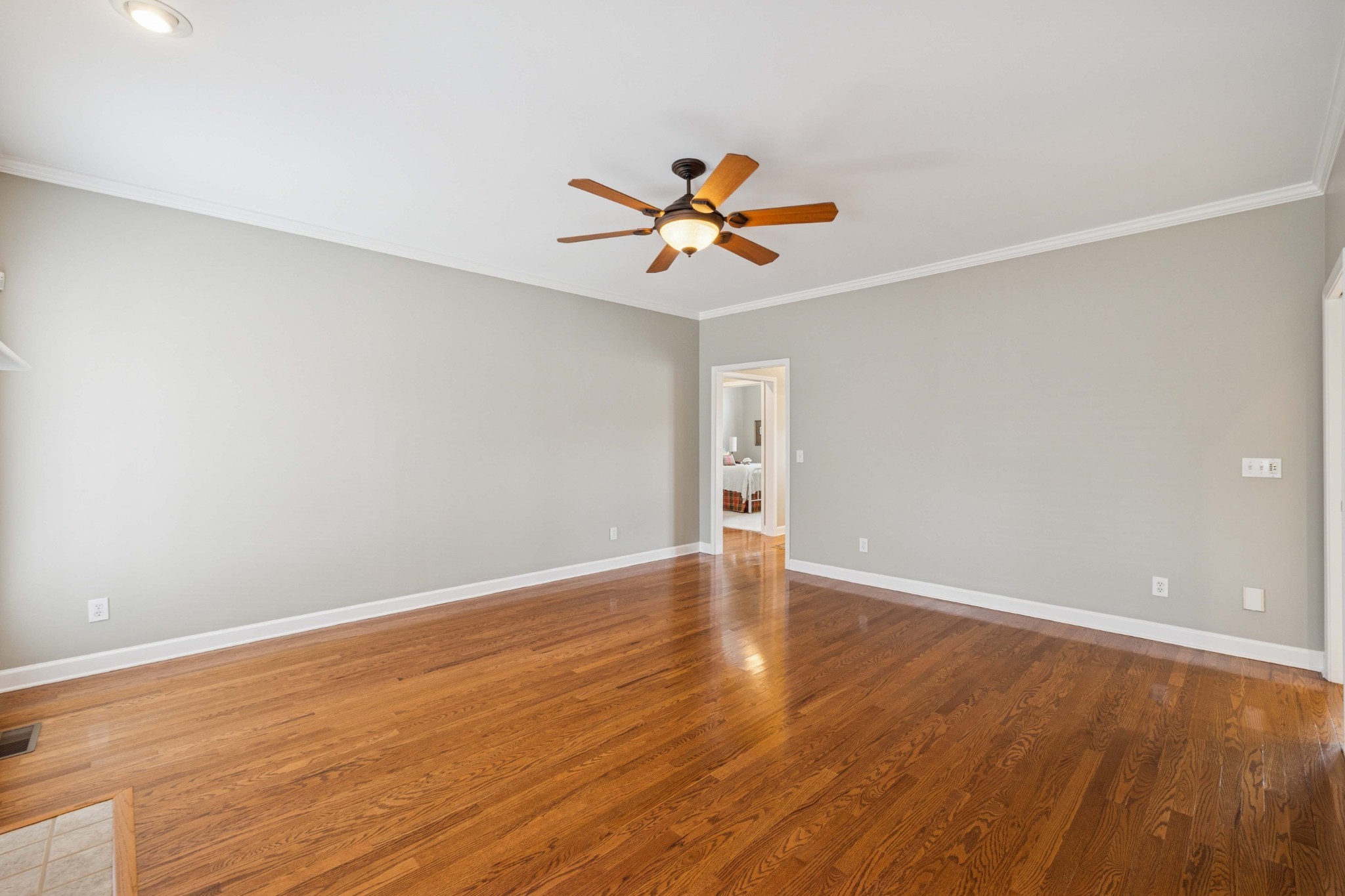1205 Rock Springs Road Smyrna, TN 37167 - Photo 7 of 48 a view of an empty room with window and wooden floor