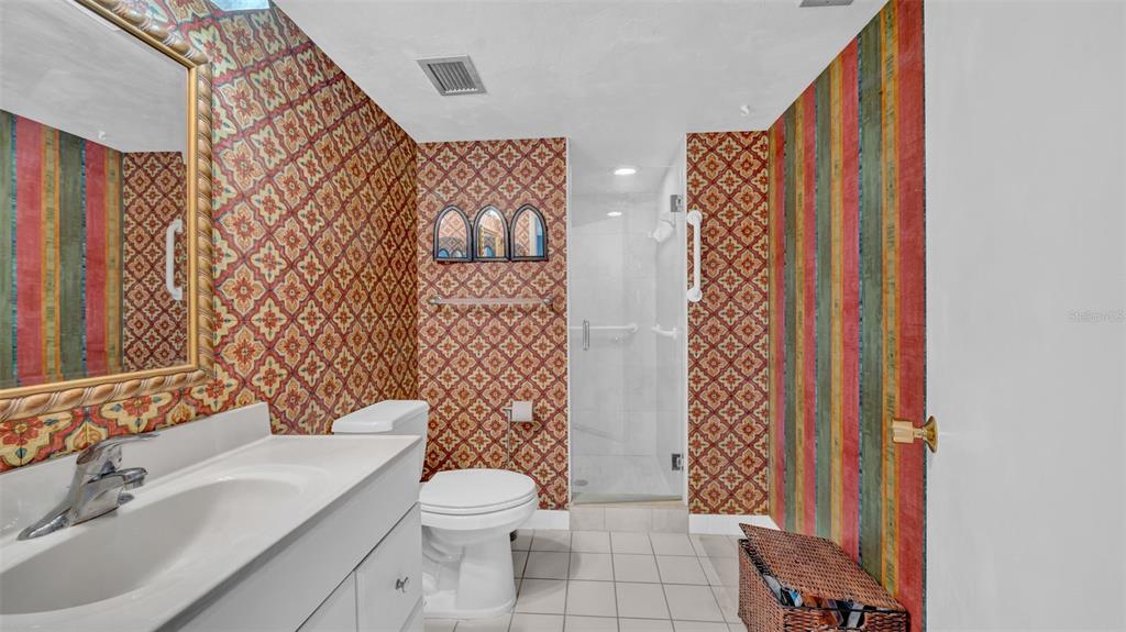 17400 Gulf Boulevard, Unit J7 Redington Shores, FL 33708 - Photo 26 of 32 a bathroom with a sink toilet and shower