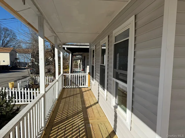 a view of a bathroom with a tub and shower