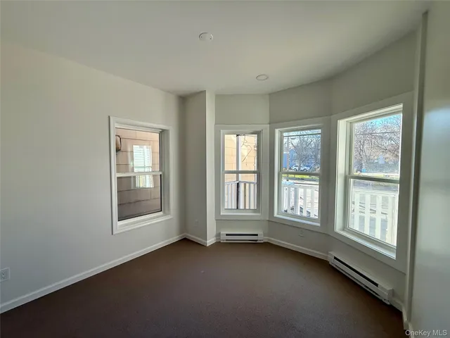 a view of a kitchen with a sink and a window