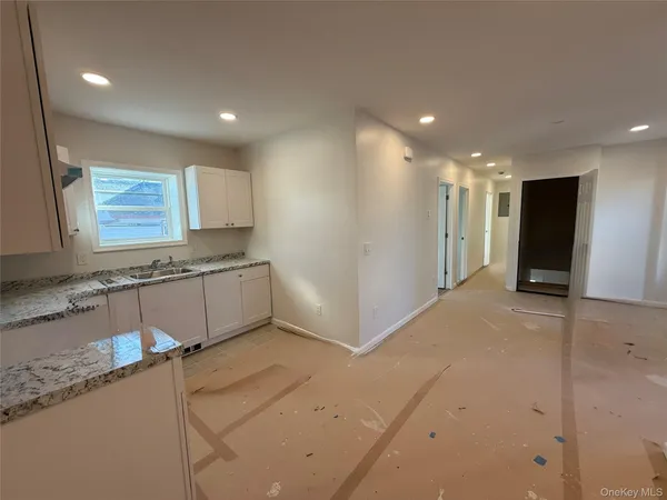 a view of hallway with a large window