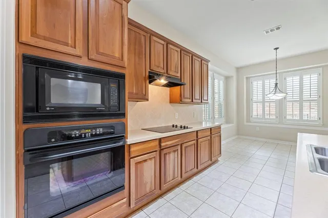 a kitchen with a stove and a microwave