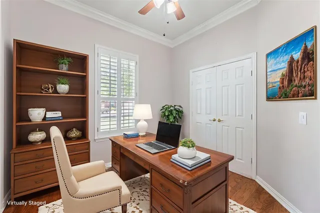 a view of a workspace with furniture and cabinet