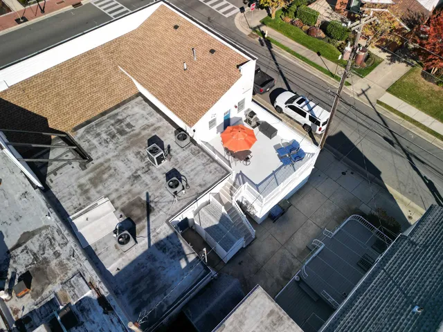 an aerial view of a house with a outdoor space