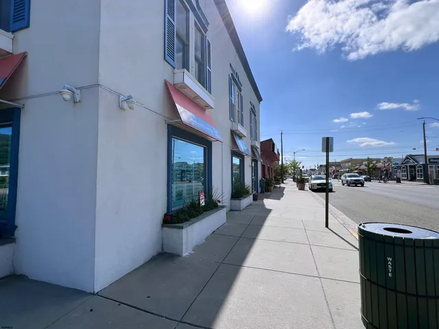 a lobby with a couch and a potted plant