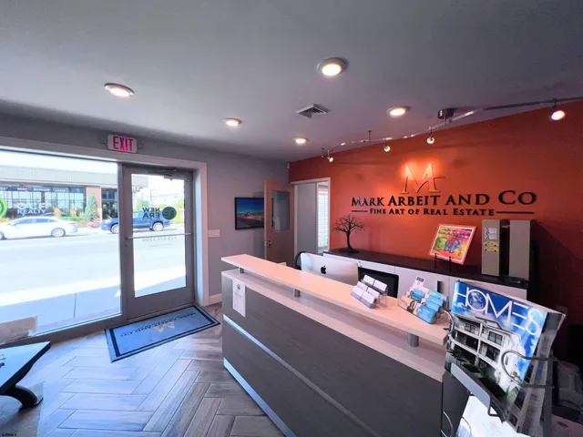 a large room with furniture and a wooden floor