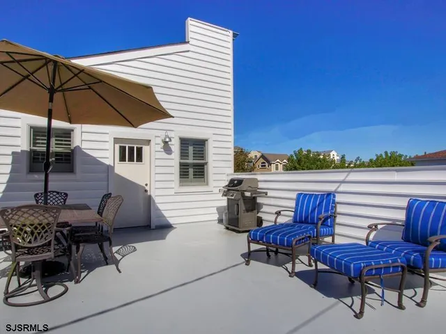 a view of a terrace with sitting area