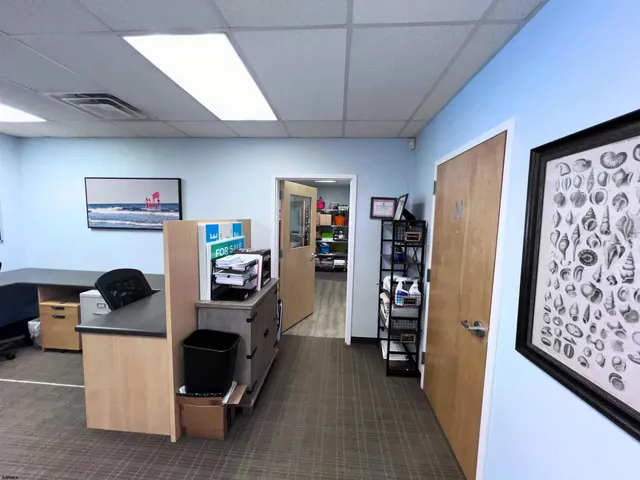 a living room with furniture and storage