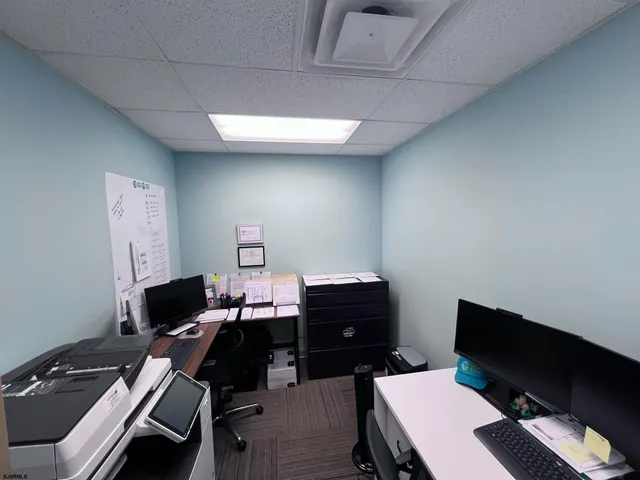 a workspace with furniture and lamp