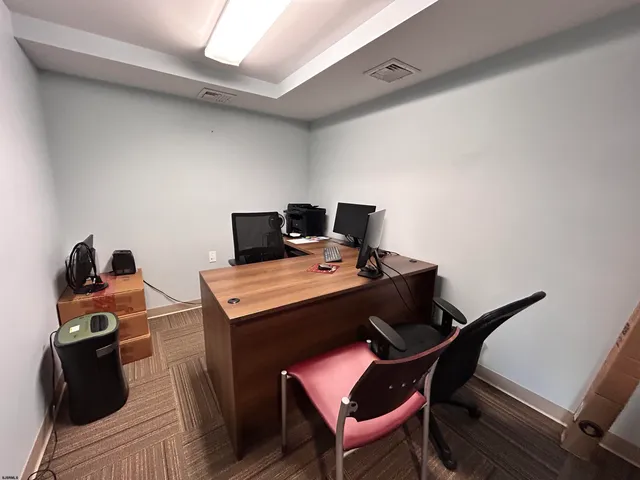 a view of a workspace with furniture