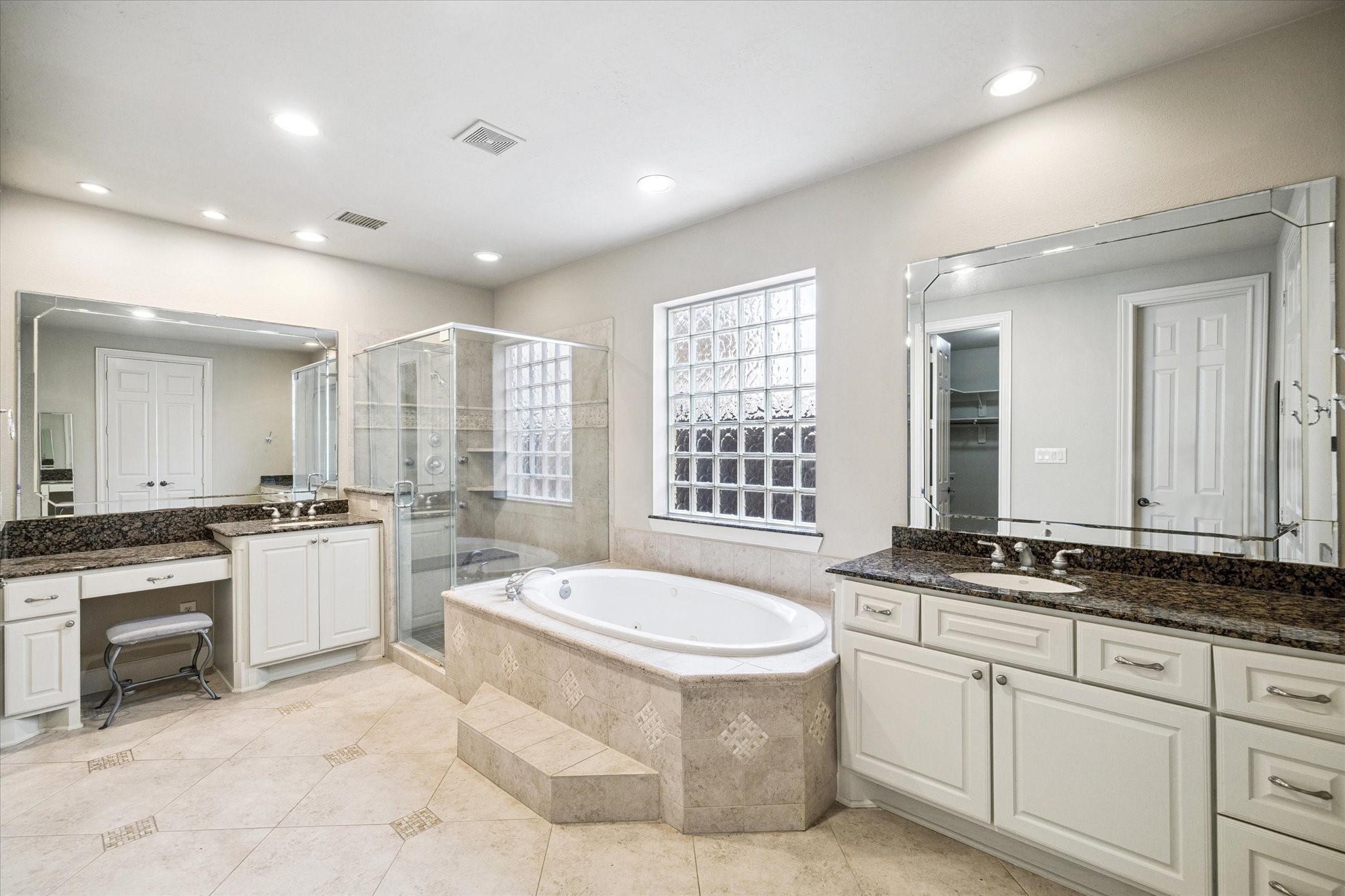 3327 Louvre Lane Houston, TX 77082 - Photo 17 of 31 a large white kitchen with a stove a sink a window and dining table