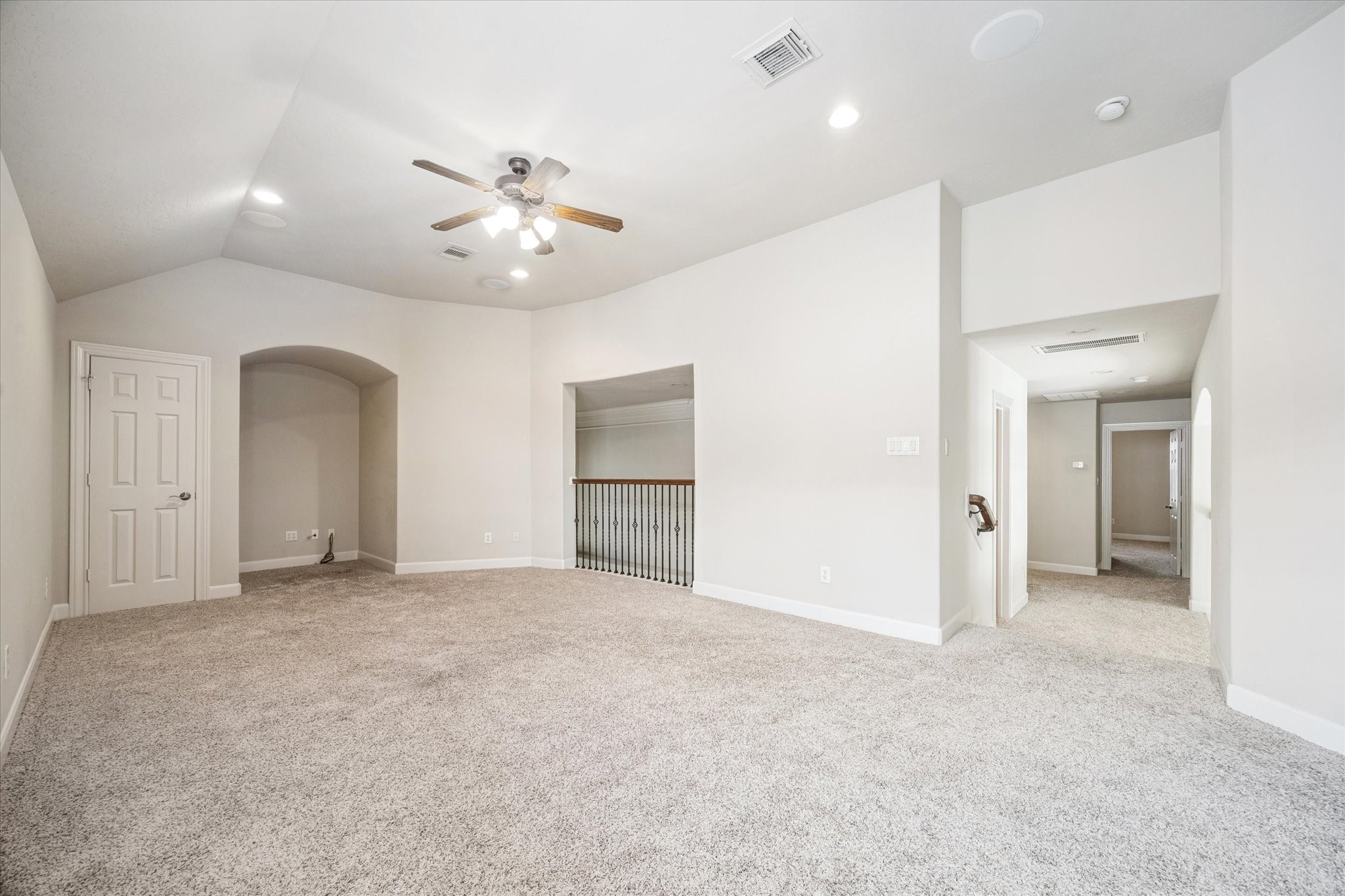 3327 Louvre Lane Houston, TX 77082 - Photo 19 of 31 an empty room with chandelier fan and kitchen view
