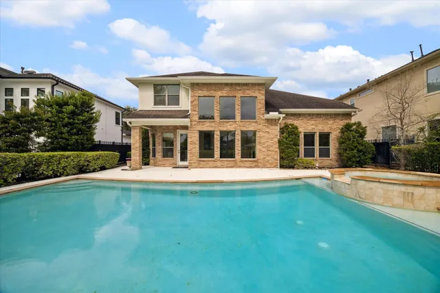 a view of a house with swimming pool