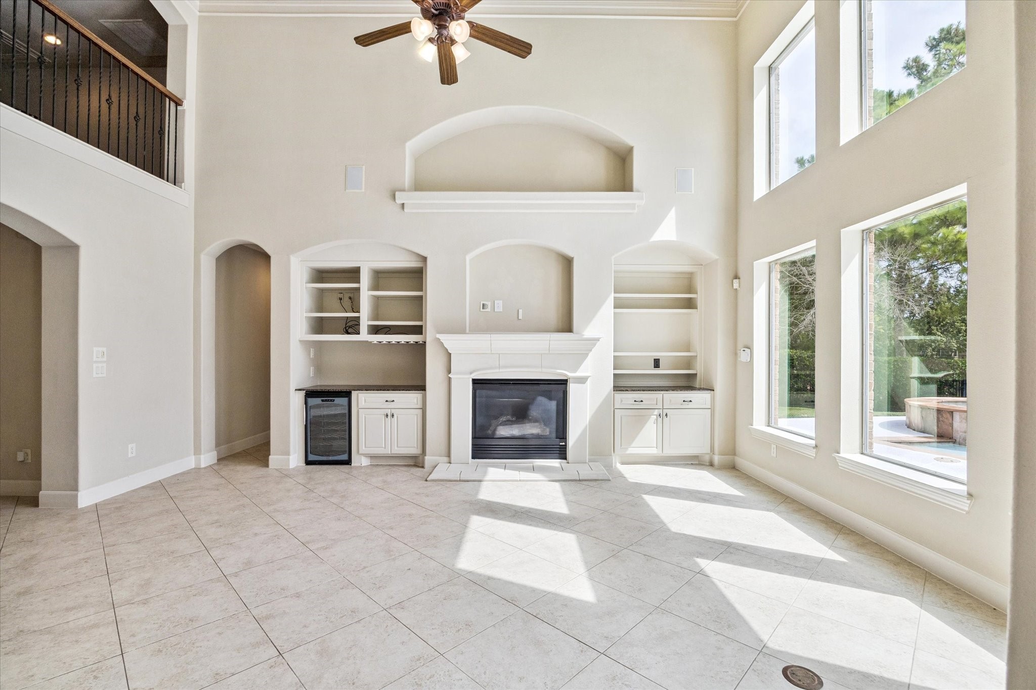 3327 Louvre Lane Houston, TX 77082 - Photo 8 of 31 a view of a livingroom with a fireplace a ceiling fan and windows
