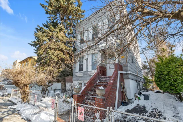 a large tree in the middle of a yard