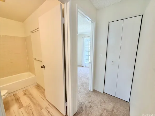 a view of bathroom with bathtub and shower