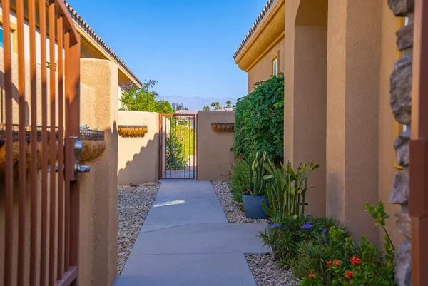 a couple of potted plants in front of door