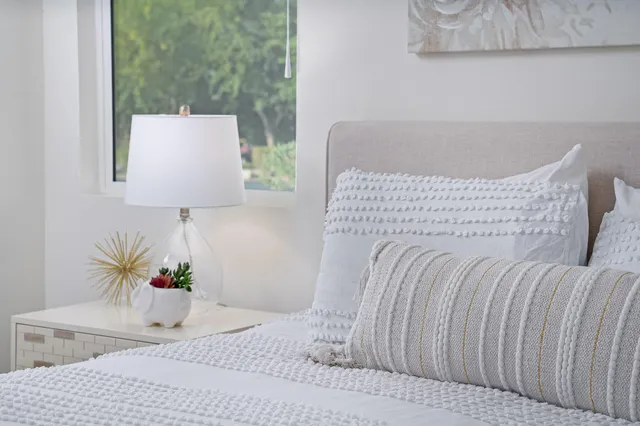 a bedroom with a bed and a couch