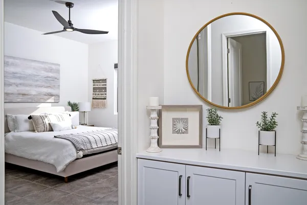 a en suite bathroom with a double vanity sink and a mirror