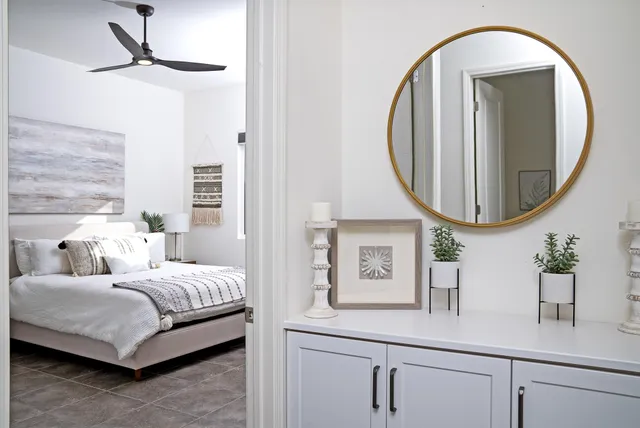 a en suite bathroom with a double vanity sink and a mirror