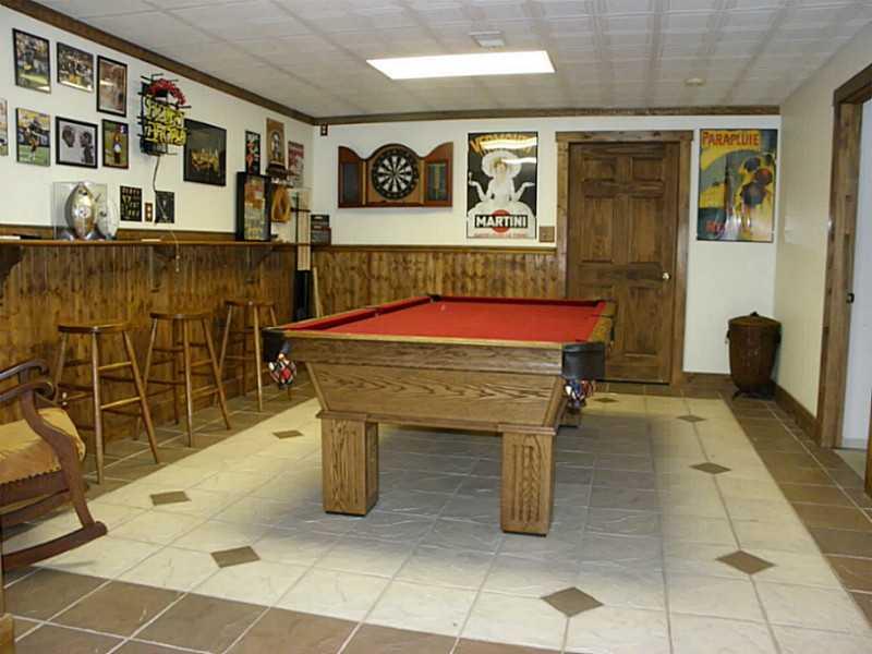 1422 Logan Road Gibsonia, PA 15044 - Photo 15 of 25 Family Room. Billiard room with ceramic tile floor and wainscoting
