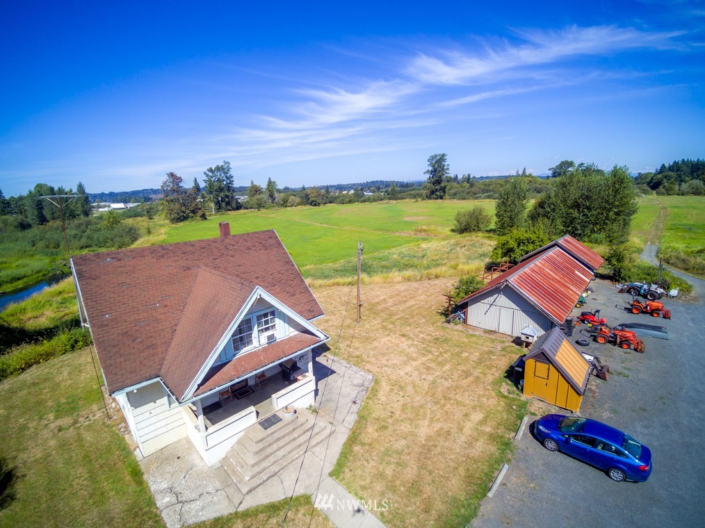 347 Newaukum Valley Road Chehalis, WA 98532 - Photo 1 of 25 an aerial view of a house with a garden and lake view