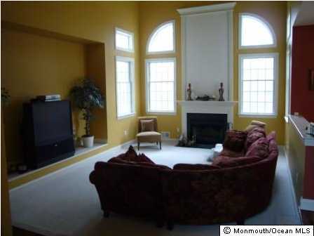 9 Mehar Court Jackson, NJ 08527 - Photo 3 of 3 a living room with furniture and a fireplace
