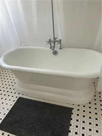 a utility room with two washing machine