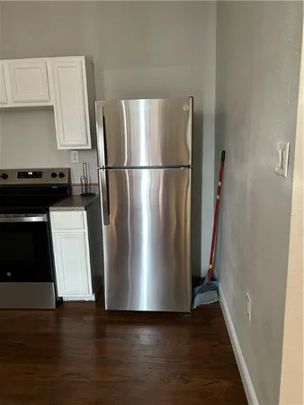 a stove top oven sitting inside of a kitchen