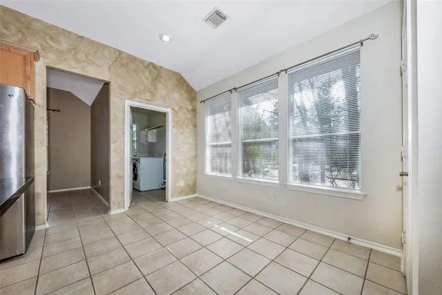 a view of an empty room and window