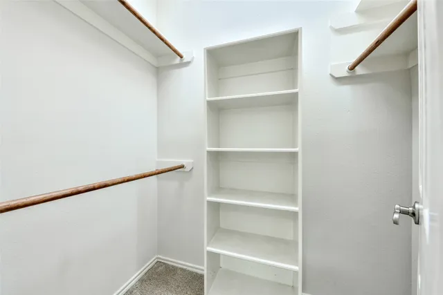 a view of an empty walk in closet
