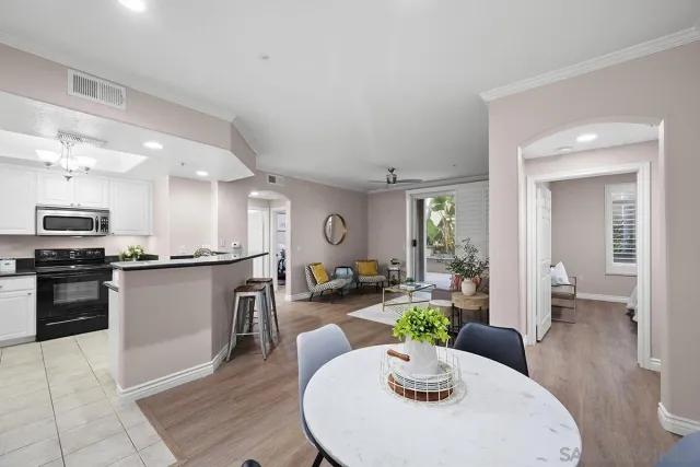 a kitchen with a table and chairs in it