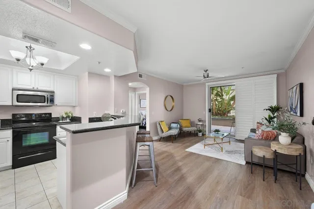 a kitchen with stainless steel appliances granite countertop a refrigerator a stove a sink dishwasher and a refrigerator