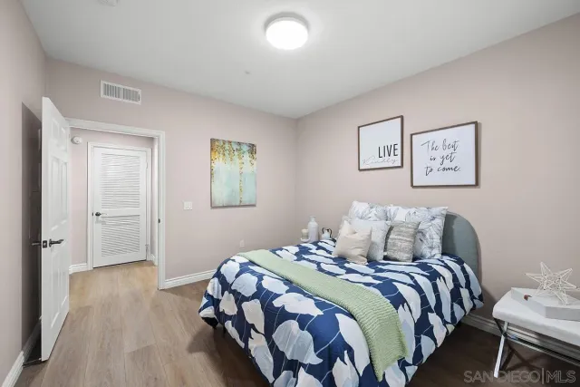 a bathroom with a shower and a glass door