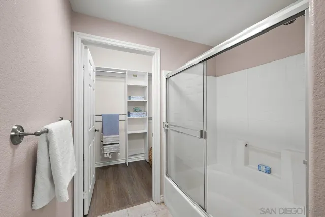a view of kitchen with utility room and wooden floor