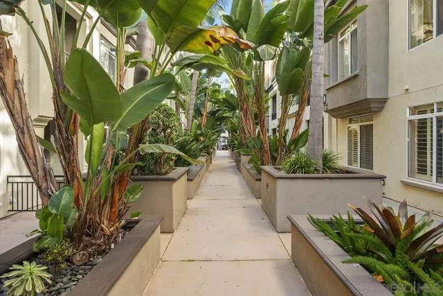 a front view of a building with sitting area