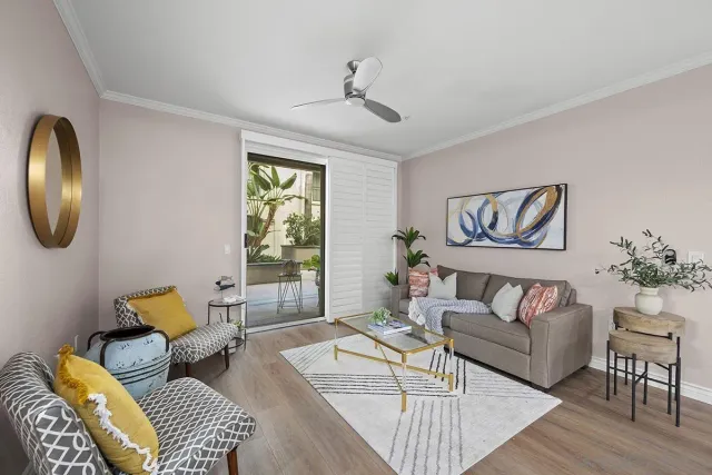 a kitchen with a refrigerator a stove a dining table and chairs