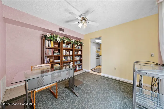 a work room with furniture and window