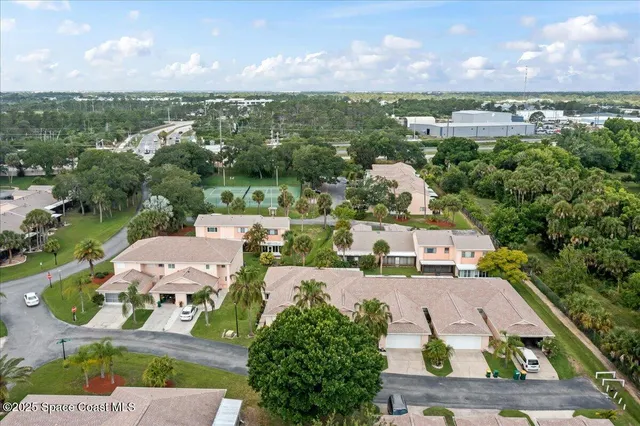 an aerial view of a house with a garden