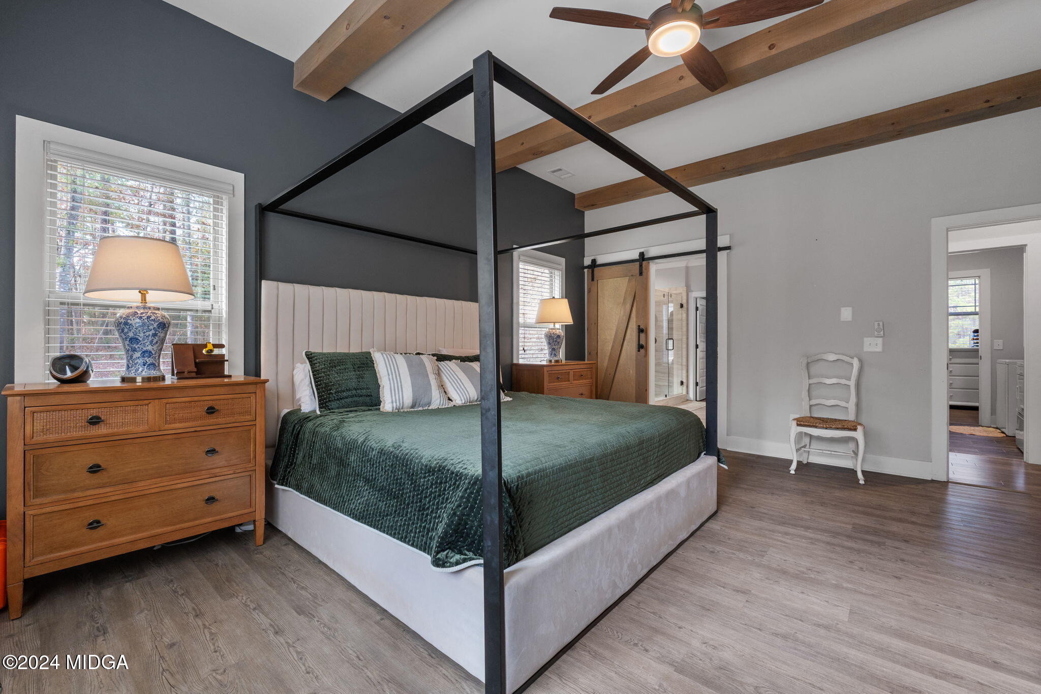 131 Belmont Way Forsyth, GA 31029 - Photo 25 of 68 a bedroom with a bed and a mirror on the dresser