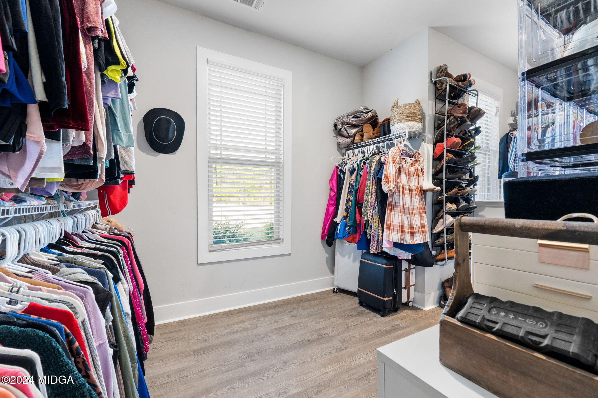131 Belmont Way Forsyth, GA 31029 - Photo 29 of 68 a view of walk in closet with clothes and shoes