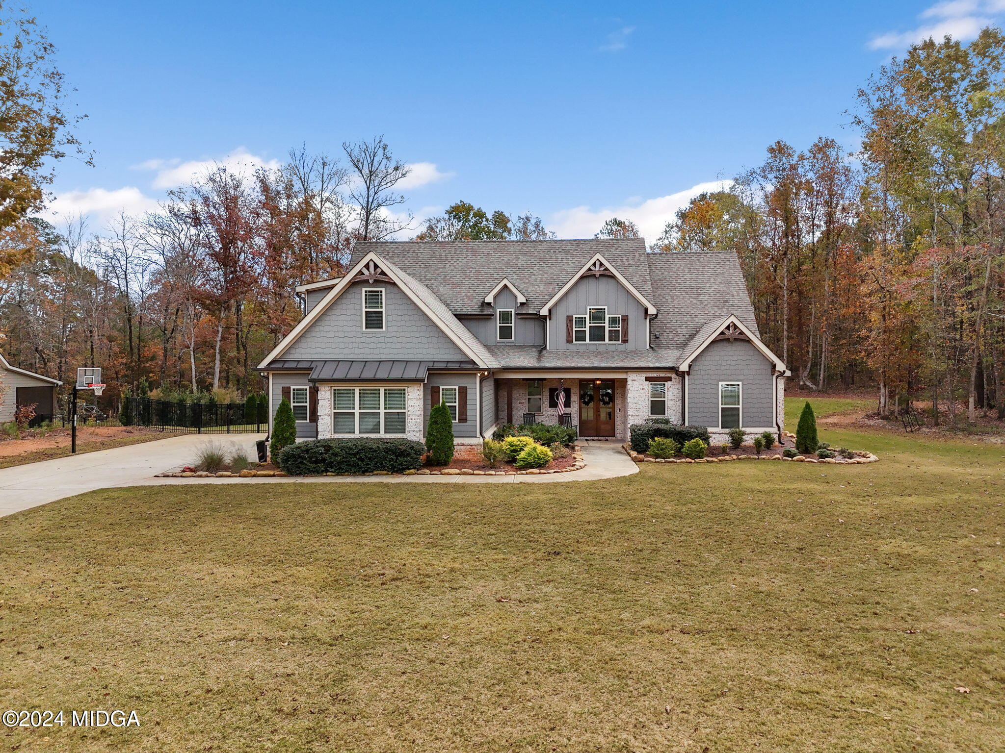 131 Belmont Way Forsyth, GA 31029 - Photo 3 of 68 a front view of a house with a yard