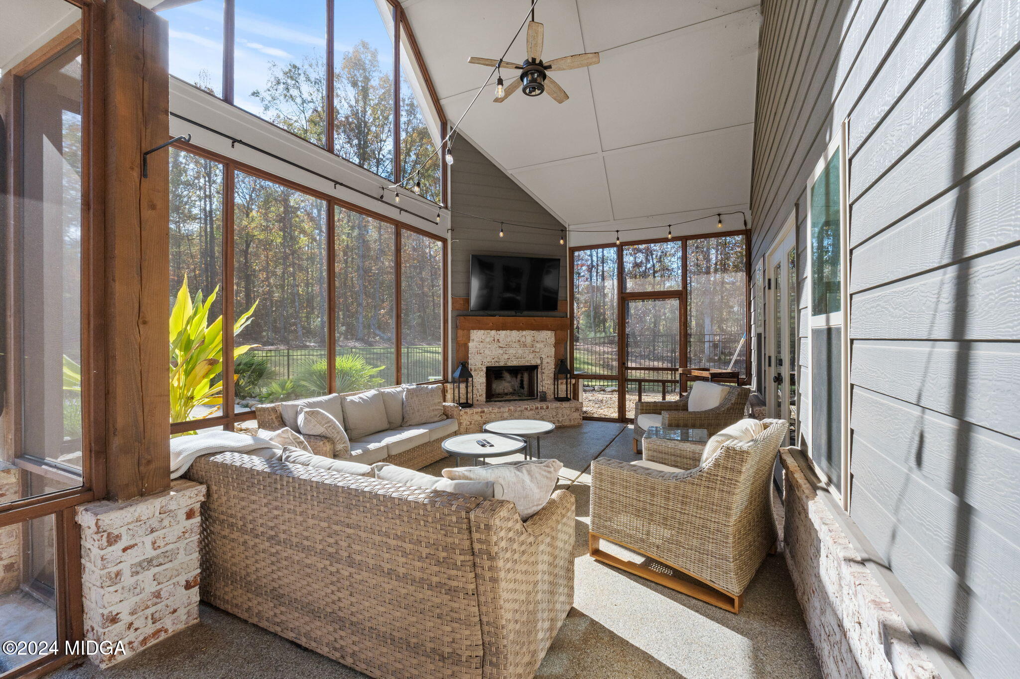 131 Belmont Way Forsyth, GA 31029 - Photo 46 of 68 a living room with fireplace furniture and a large window