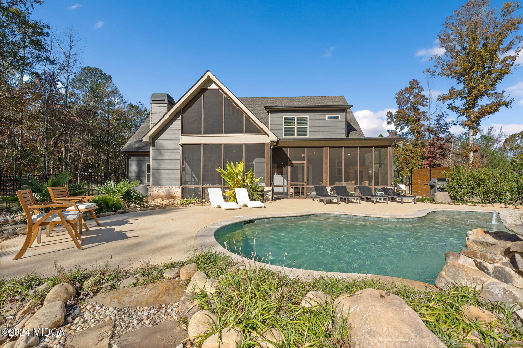 131 Belmont Way Forsyth, GA 31029 - Photo 50 of 68 a front view of a house with garden and patio
