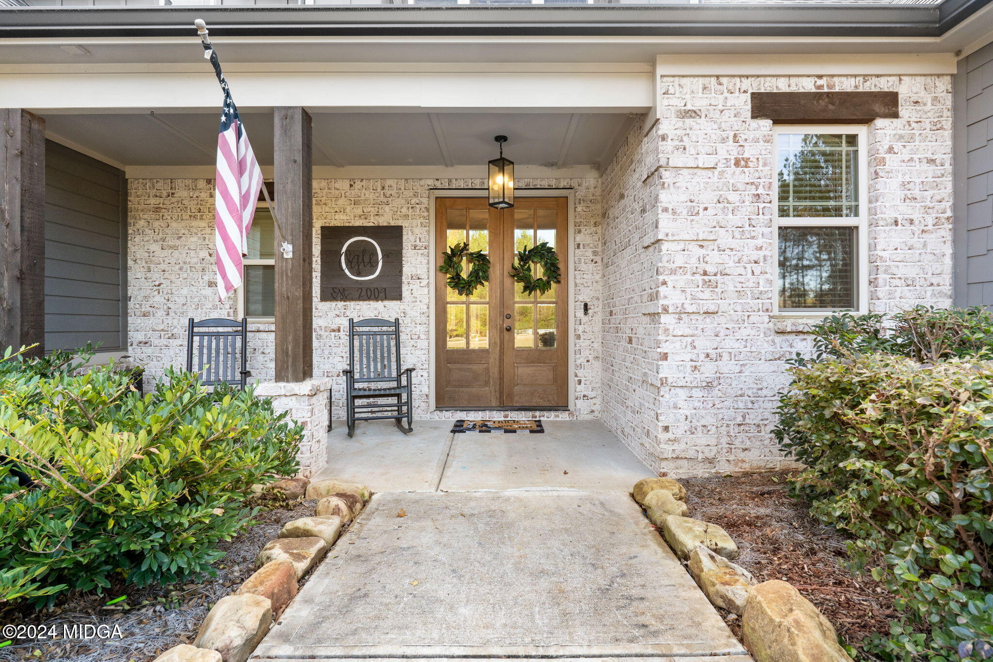 131 Belmont Way Forsyth, GA 31029 - Photo 5 of 68 a front view of a house with a porch