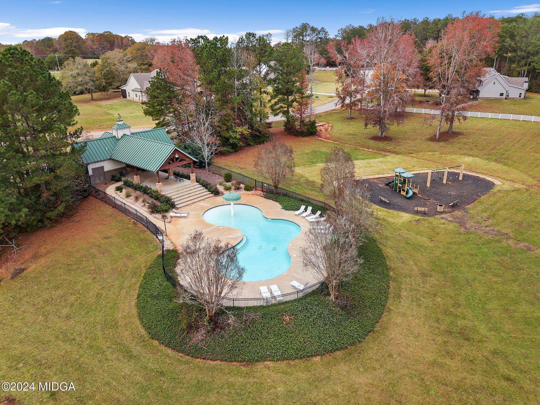 131 Belmont Way Forsyth, GA 31029 - Photo 66 of 68 a view of a swimming pool with a yard and mountain view