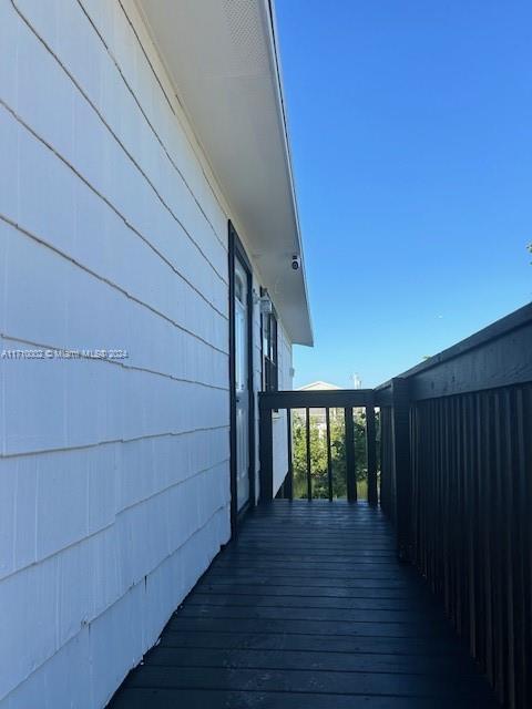 74 Pelican Lane, Unit 1 Big Pine Key, FL 33043 - Photo 12 of 23 a view of entryway with wooden floor