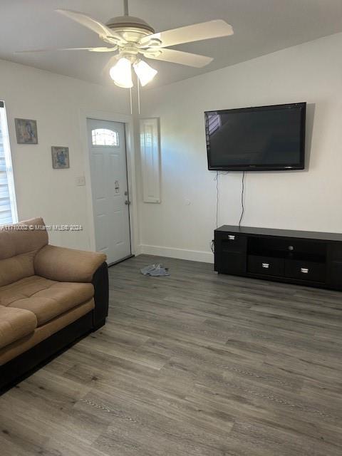 74 Pelican Lane, Unit 1 Big Pine Key, FL 33043 - Photo 15 of 23 a living room with furniture and a flat screen tv