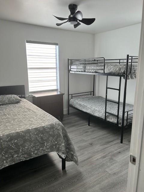 74 Pelican Lane, Unit 1 Big Pine Key, FL 33043 - Photo 20 of 23 a bedroom with a bed and a table