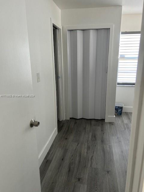 74 Pelican Lane, Unit 1 Big Pine Key, FL 33043 - Photo 22 of 23 a view of a room with wooden floor